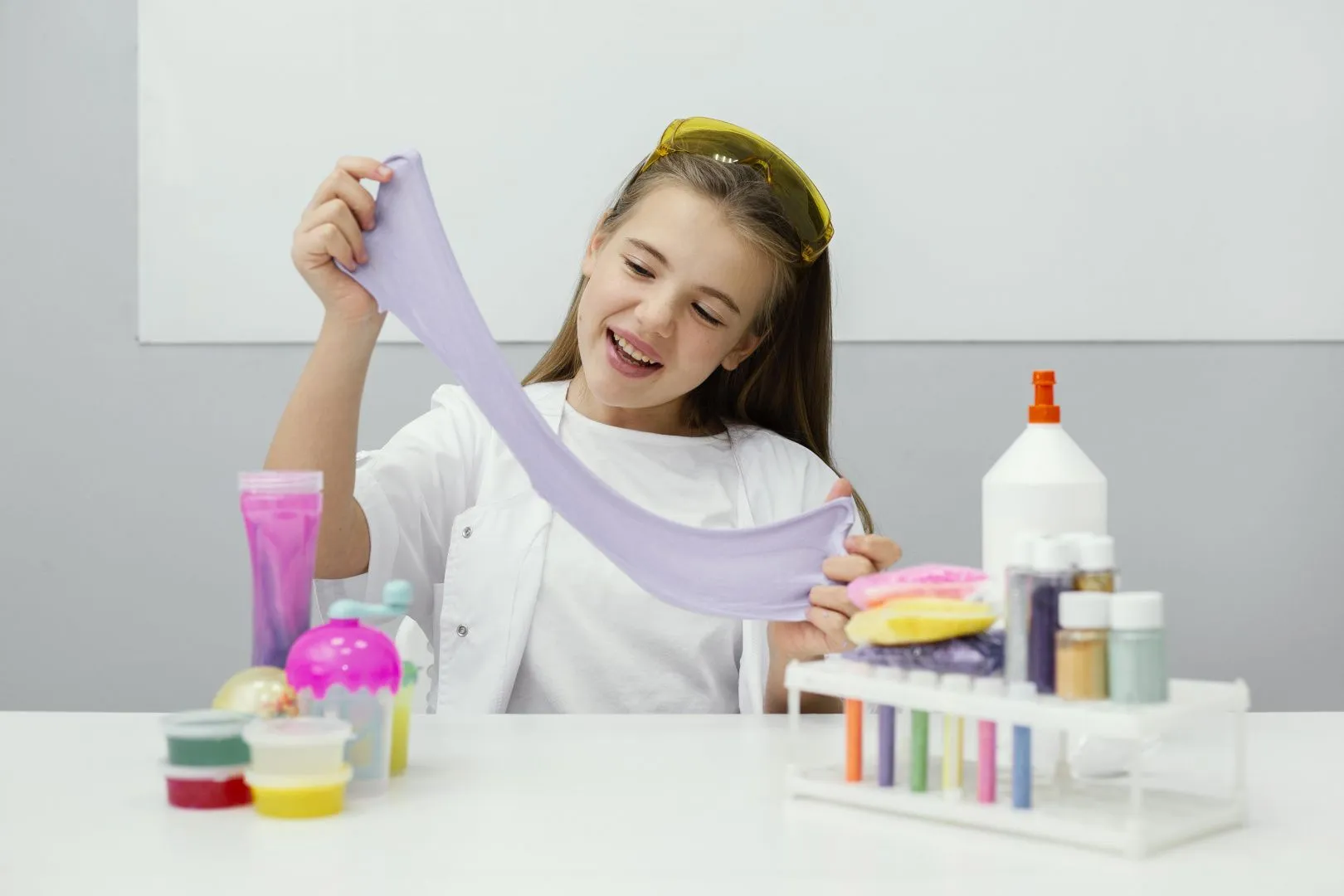 smiley-young-girl-scientist-making-slime.jpg